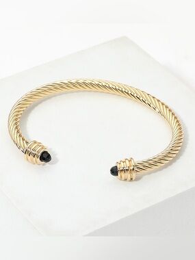 Gold Twisted Cable Cuff Bracelet with Black Stone Ends